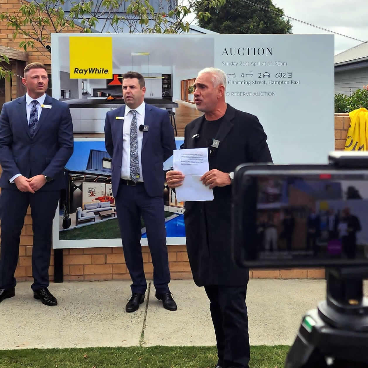 Auctioneer Tom Panos conducting the auction of 22 Charming Street Hampton East on behalf of Adrian Portelli